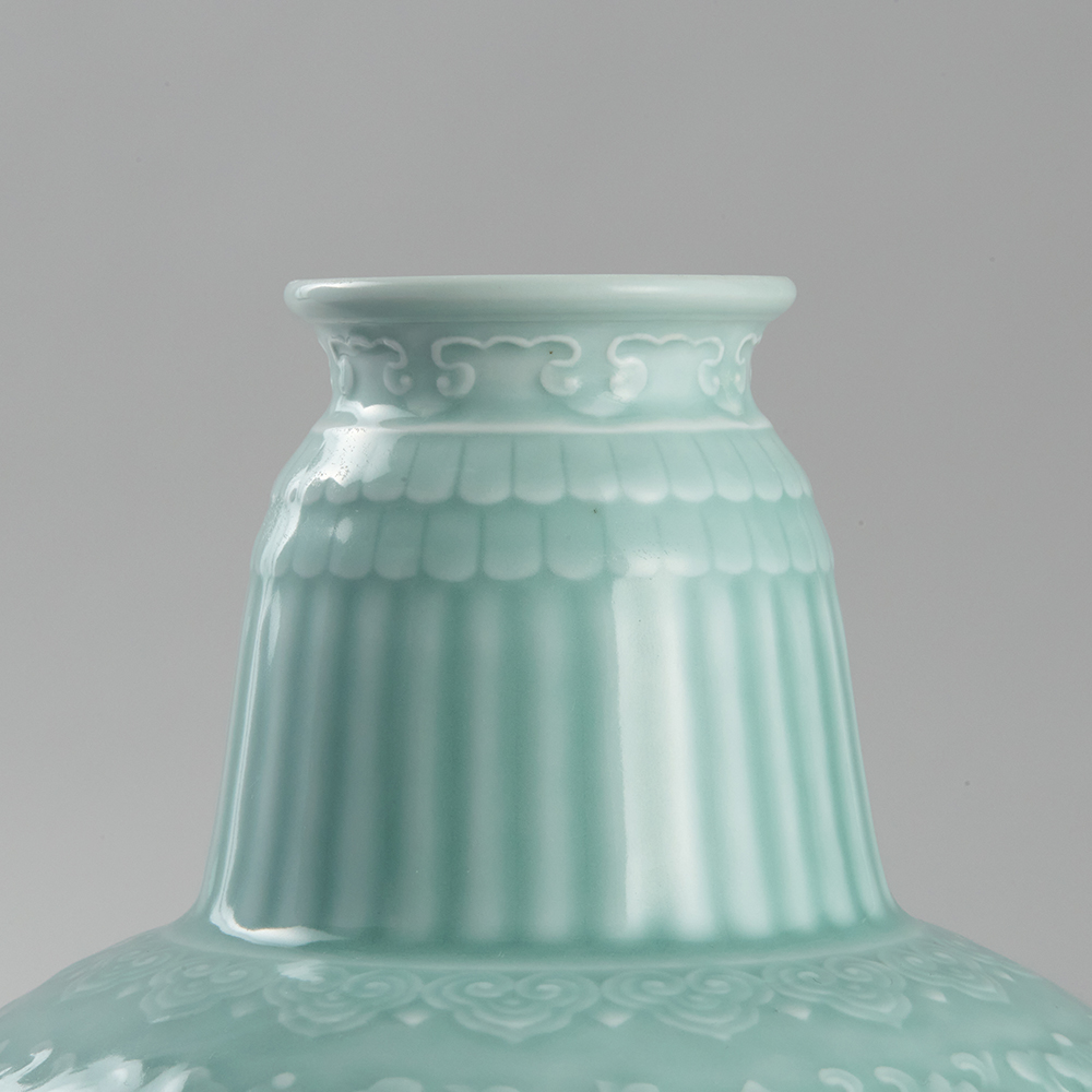 Lot1042 QING DOUQING GLAZE CARVED PORCELAIN BENBA POT Qianlong six-character mark, but later (20th century)