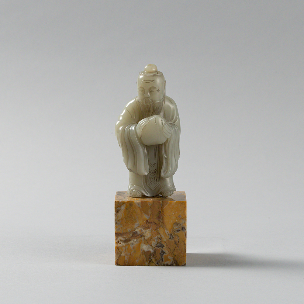 Lot2010 A PALE CELADON JADE FIGURE OF A DONGFANG SHUO(東方朔) QING DYNASTY(17TH TO 18TH CENTURY)