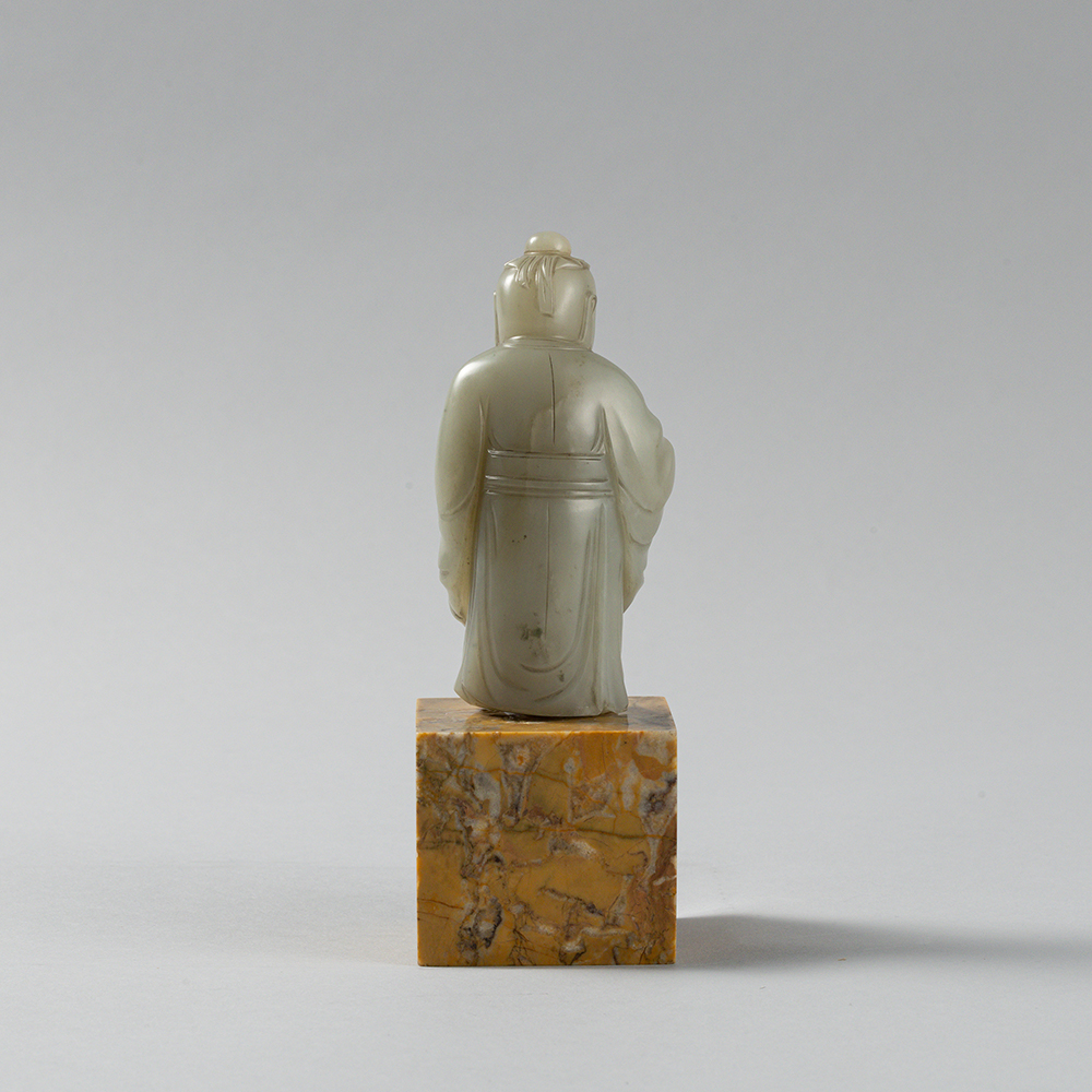 Lot2010 A PALE CELADON JADE FIGURE OF A DONGFANG SHUO(東方朔) QING DYNASTY(17TH TO 18TH CENTURY)