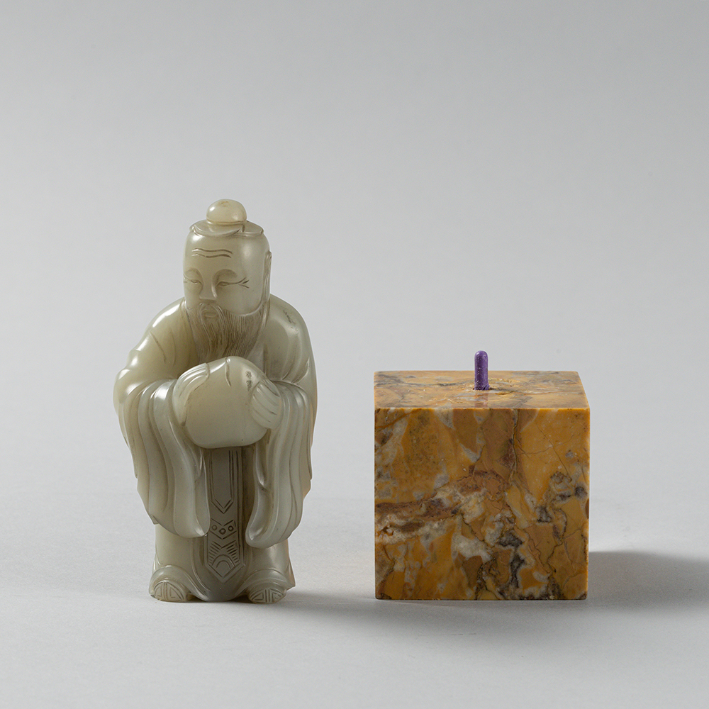 Lot2010 A PALE CELADON JADE FIGURE OF A DONGFANG SHUO(東方朔) QING DYNASTY(17TH TO 18TH CENTURY)