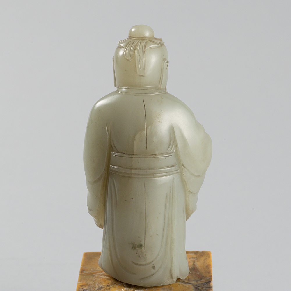 Lot2010 A PALE CELADON JADE FIGURE OF A DONGFANG SHUO(東方朔) QING DYNASTY(17TH TO 18TH CENTURY)