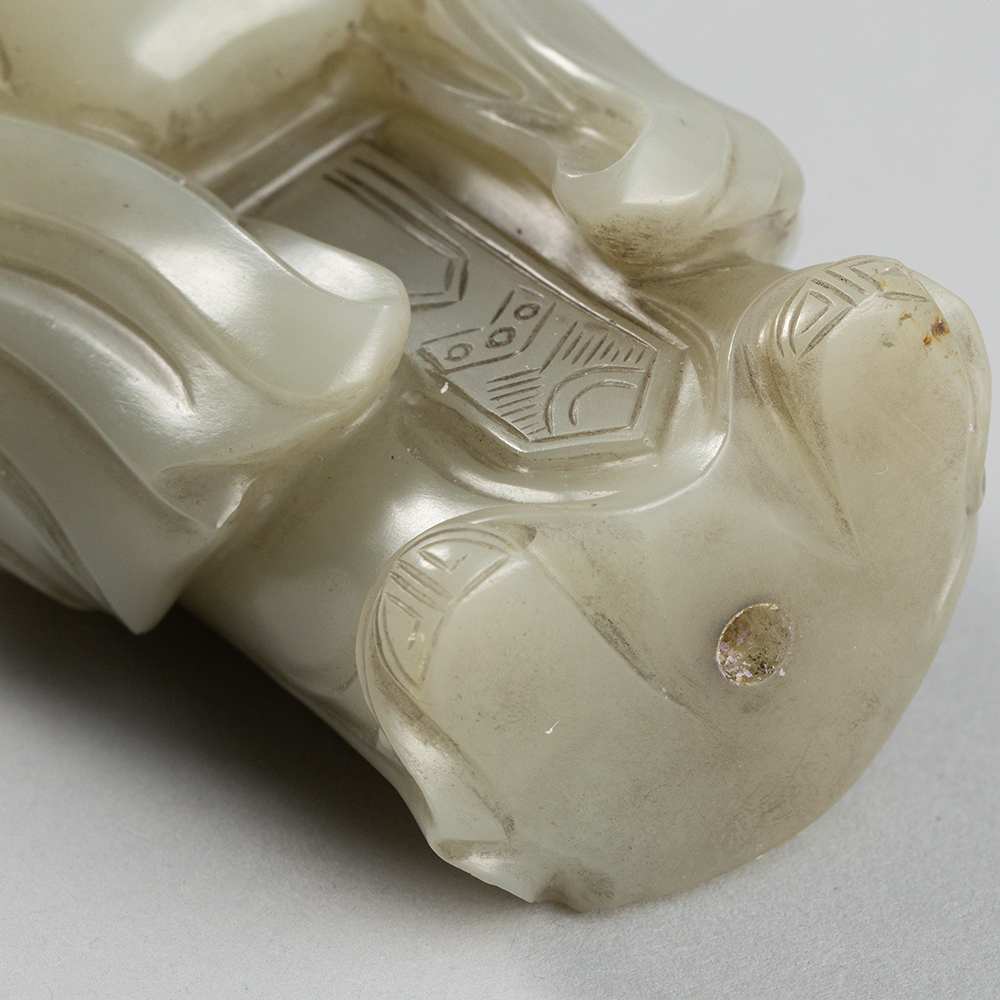 Lot2010 A PALE CELADON JADE FIGURE OF A DONGFANG SHUO(東方朔) QING DYNASTY(17TH TO 18TH CENTURY)