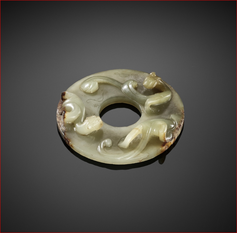 Lot2027 A CELADON JADE DISC WITH COILED DRAGONS, WESTERN HAN DYNASTY (BC 2세기-1세기 경)